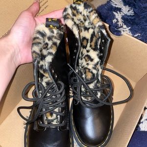 Black Doc Martens boots with cozy cheetah fur on the inside